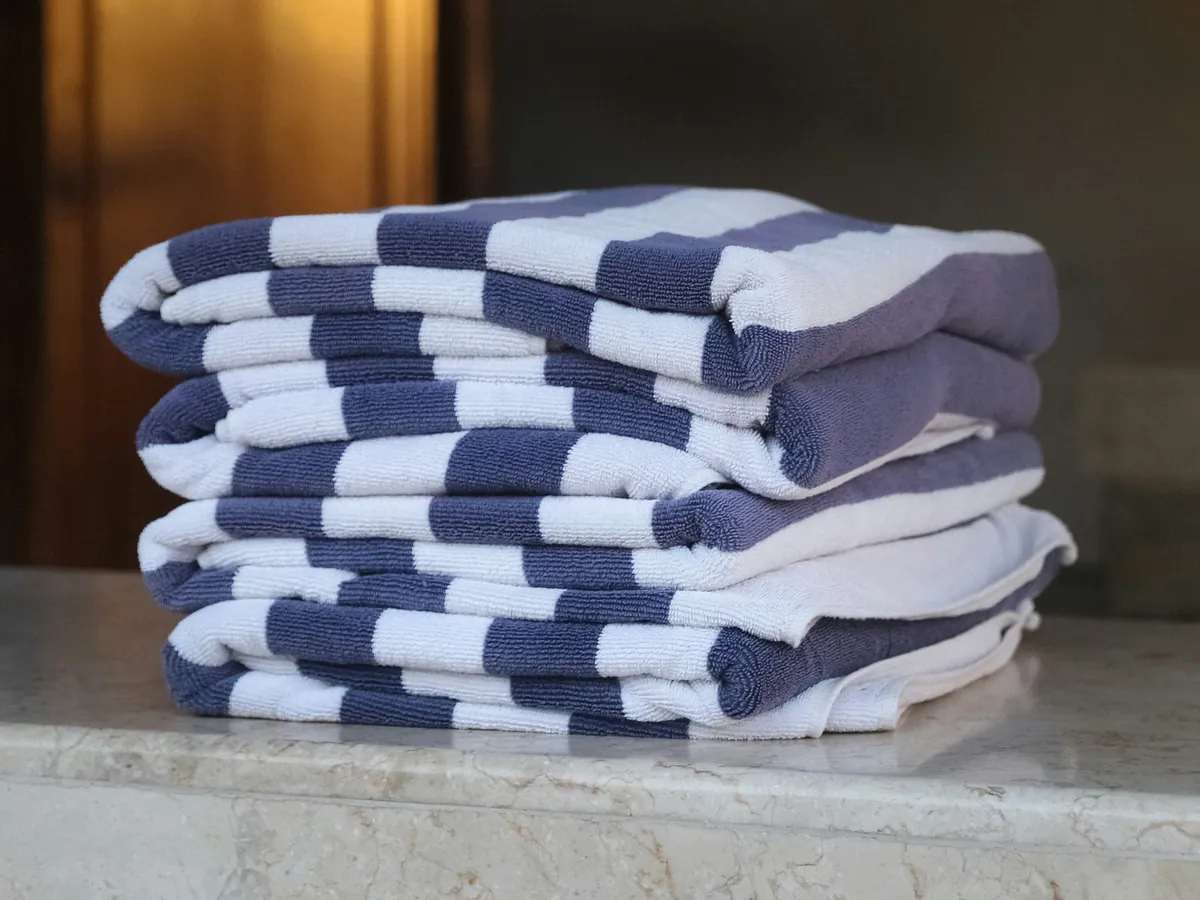 Stack of folded blue and white striped towels